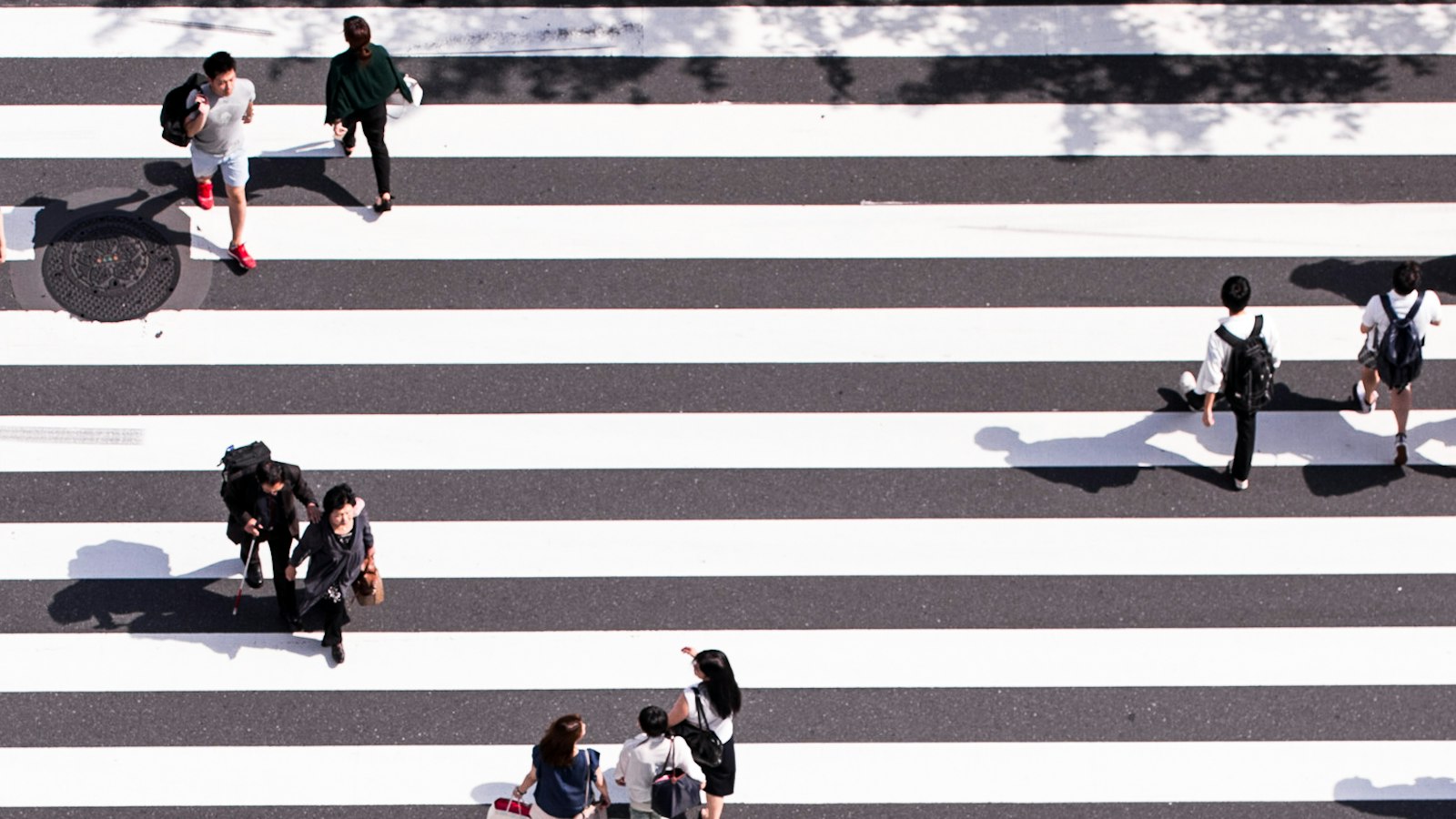 Crowds crossing the Shibuya Scramble intersection from above